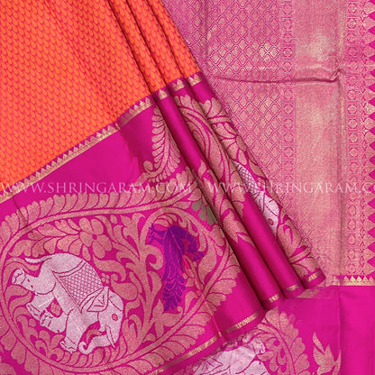 Orange Kanjivaram Silk Saree With Rani Pink Border.