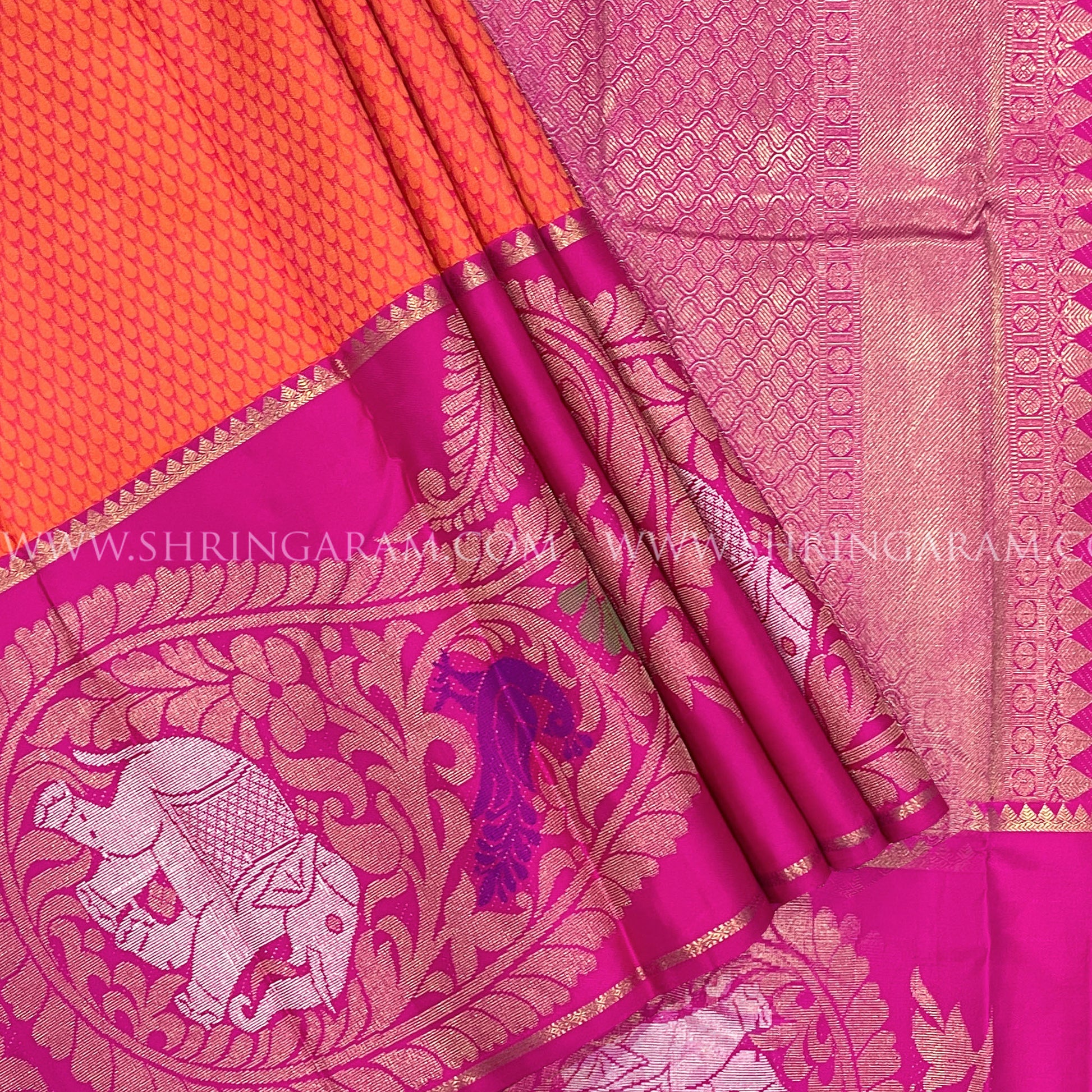 Orange Kanjivaram Silk Saree With Rani Pink Border.