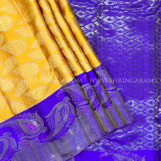 Mustard Yellow With Purple Border And Gold Zari Work.